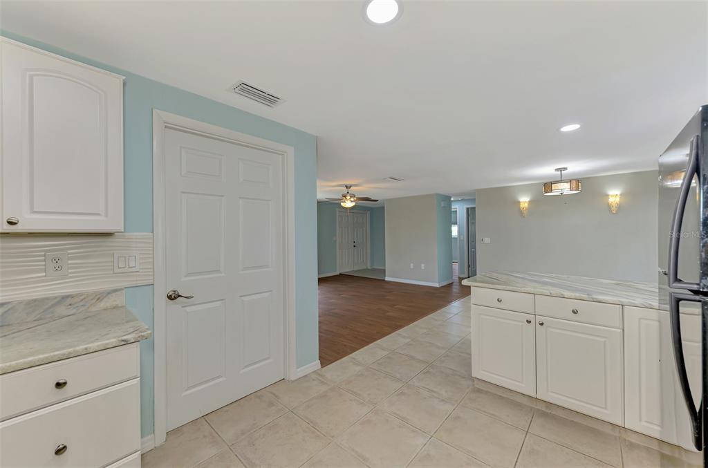 2490 Eleventh Street Englewood, FL 34224 - Photo 15 of 49 a view of a hallway to closet and utility room