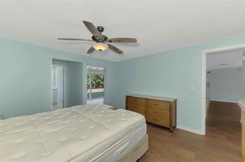 2490 Eleventh Street Englewood, FL 34224 - Photo 22 of 49 a bedroom with a bed and a ceiling fan