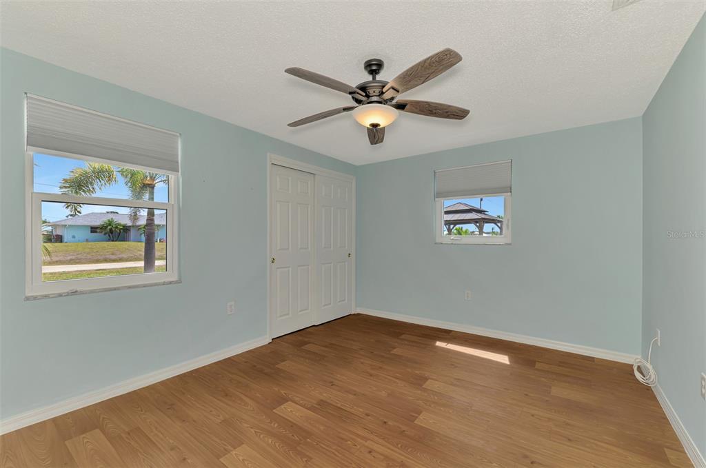 2490 Eleventh Street Englewood, FL 34224 - Photo 25 of 49 a view of a room with wooden floor fan and windows