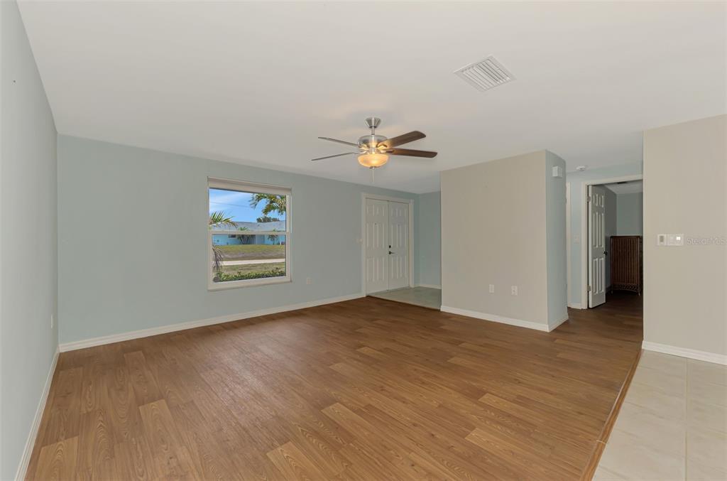 2490 Eleventh Street Englewood, FL 34224 - Photo 26 of 49 an empty room with wooden floor and window