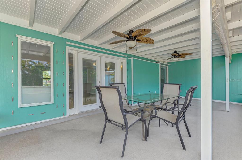 2490 Eleventh Street Englewood, FL 34224 - Photo 30 of 49 a view of a porch with furniture and a yard