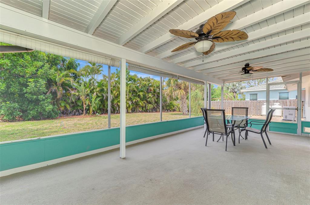 2490 Eleventh Street Englewood, FL 34224 - Photo 32 of 49 a dining room with furniture and a garden