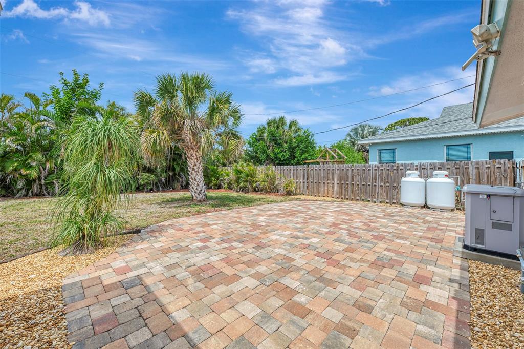 2490 Eleventh Street Englewood, FL 34224 - Photo 37 of 49 a backyard of a house with lots of green space