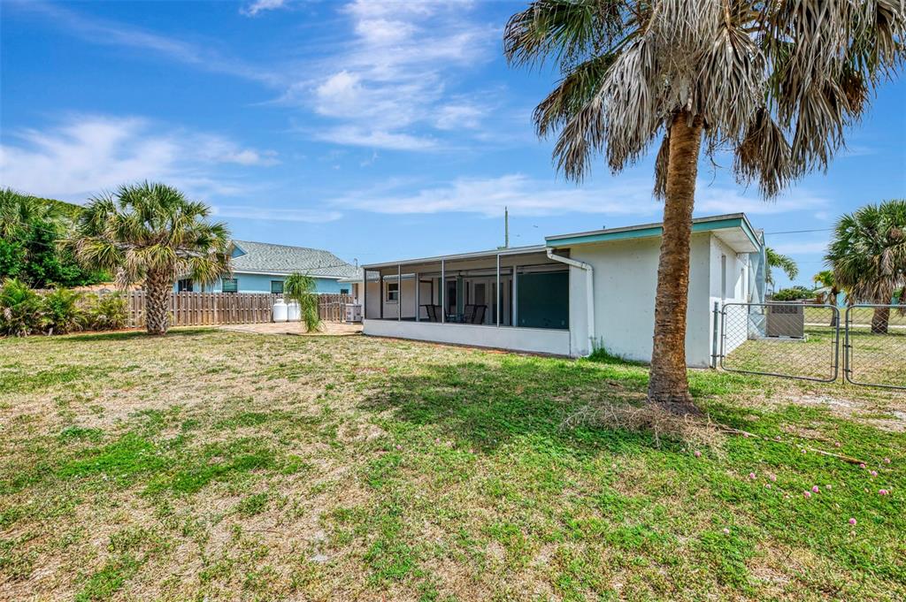 2490 Eleventh Street Englewood, FL 34224 - Photo 39 of 49 a front view of a house with a garden