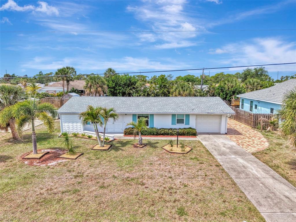 2490 Eleventh Street Englewood, FL 34224 - Photo 42 of 49 a row of houses with outdoor space