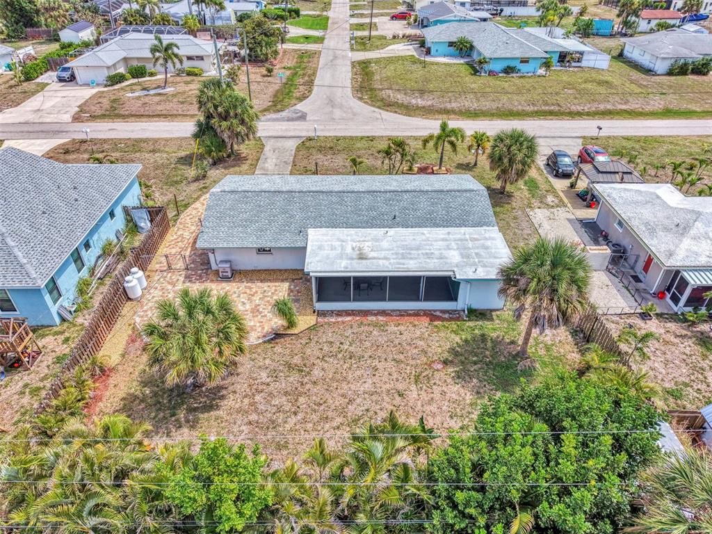 2490 Eleventh Street Englewood, FL 34224 - Photo 44 of 49 an aerial view of a house with a garden and lake view