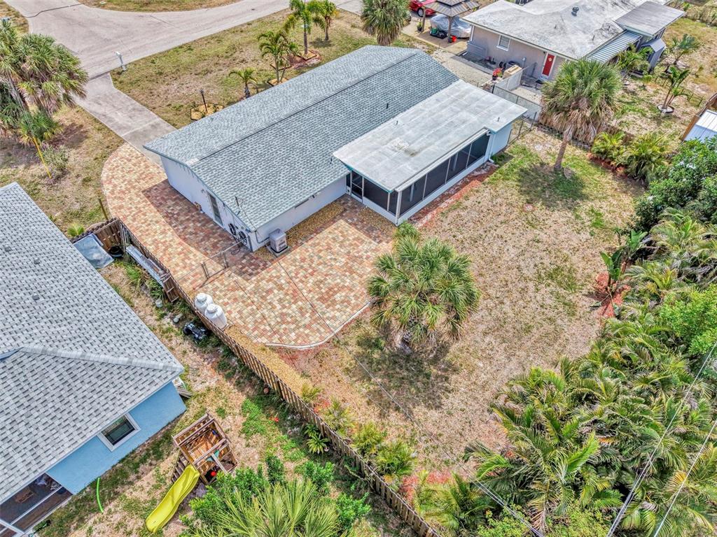 2490 Eleventh Street Englewood, FL 34224 - Photo 45 of 49 an aerial view of a house with a yard and wooden fence