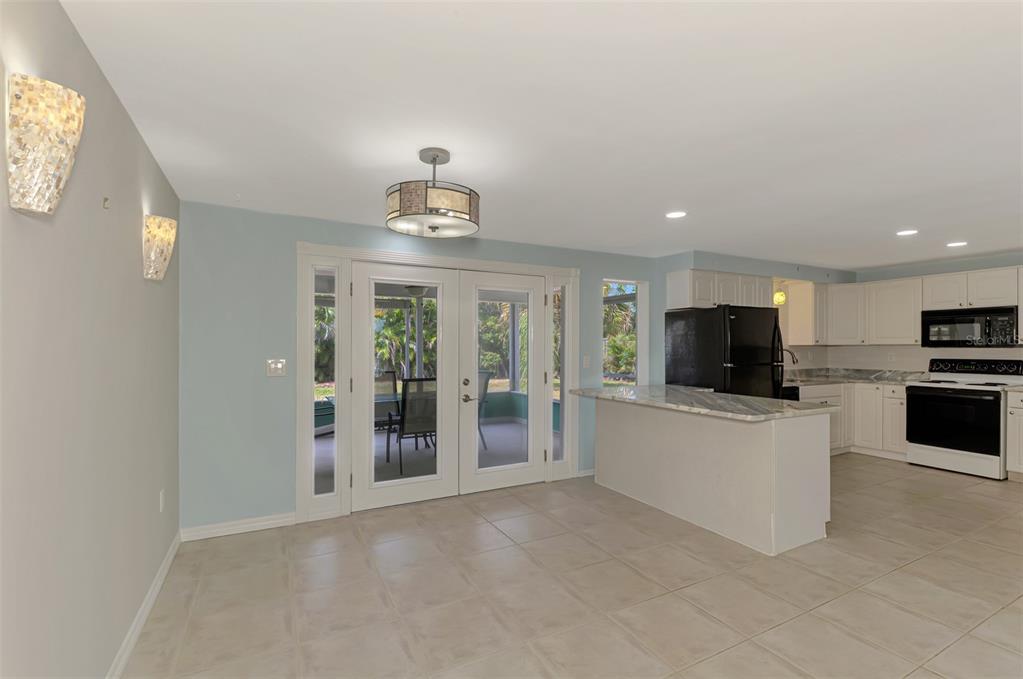 2490 Eleventh Street Englewood, FL 34224 - Photo 9 of 49 a view of kitchen with microwave and refrigerator