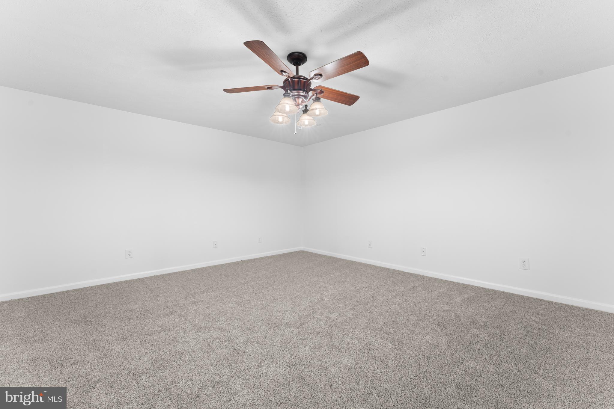 1522 Meander Run Road Locust Dale, VA 22948 - Photo 51 of 72 an empty room with window and ceiling fan