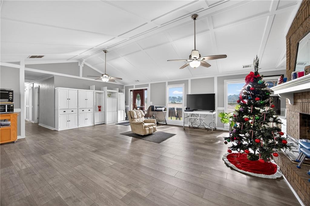 505 Stone Road McDonough, GA 30253 - Photo 11 of 28 a view of a room with lots of white furniture and a chandelier