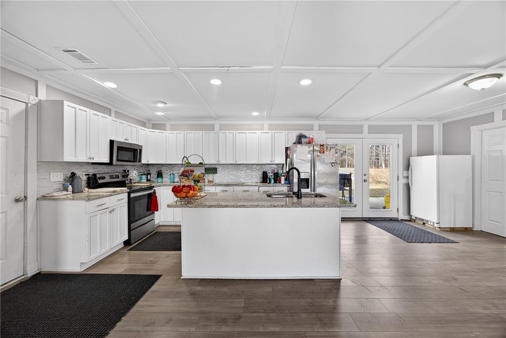 505 Stone Road McDonough, GA 30253 - Photo 14 of 28 a large white kitchen with lots of counter space and a refrigerator