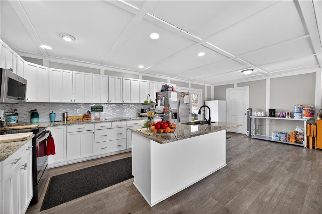 505 Stone Road McDonough, GA 30253 - Photo 15 of 28 a kitchen that has a lot of cabinets in it and appliances