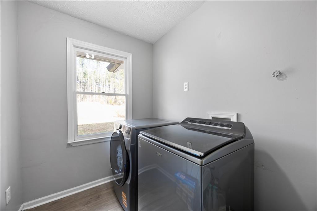 505 Stone Road McDonough, GA 30253 - Photo 16 of 28 a utility room with closet dryer and window