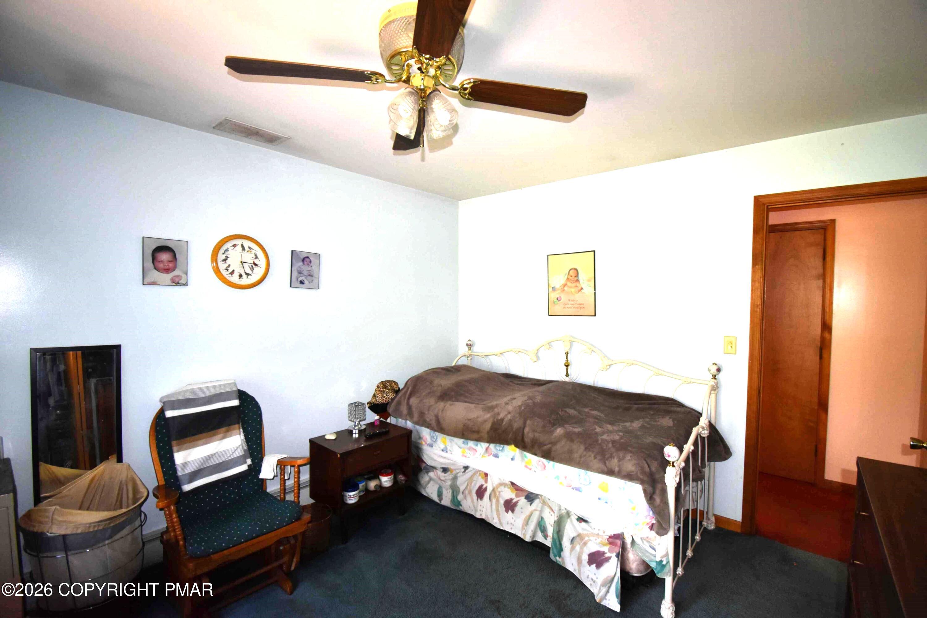 160 Quiet Valley Road Mount Bethel, PA 18343 - Photo 27 of 44 a bedroom with a bed and a chandelier
