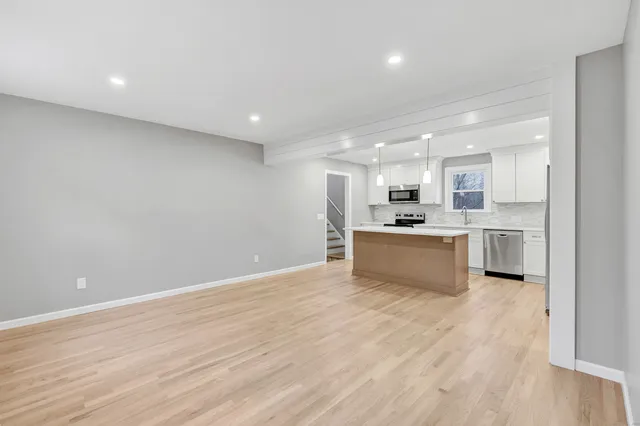 a view of kitchen with wooden floor