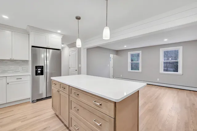 a kitchen with a refrigerator a sink and dishwasher