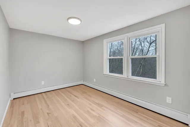 a view of an empty room with a window