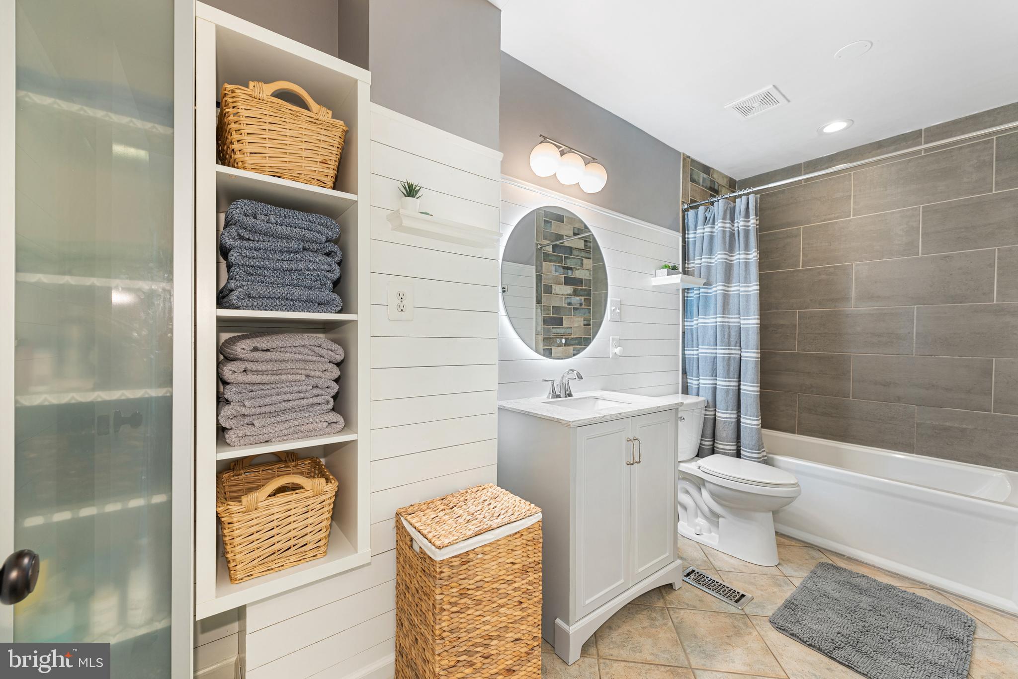 2225 Gunsmith Square Reston, VA 20191 - Photo 17 of 37 Renovated UL bath with storage and shiplap