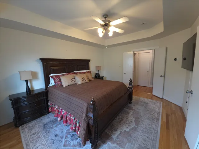 a bed room with a bed and a chandelier