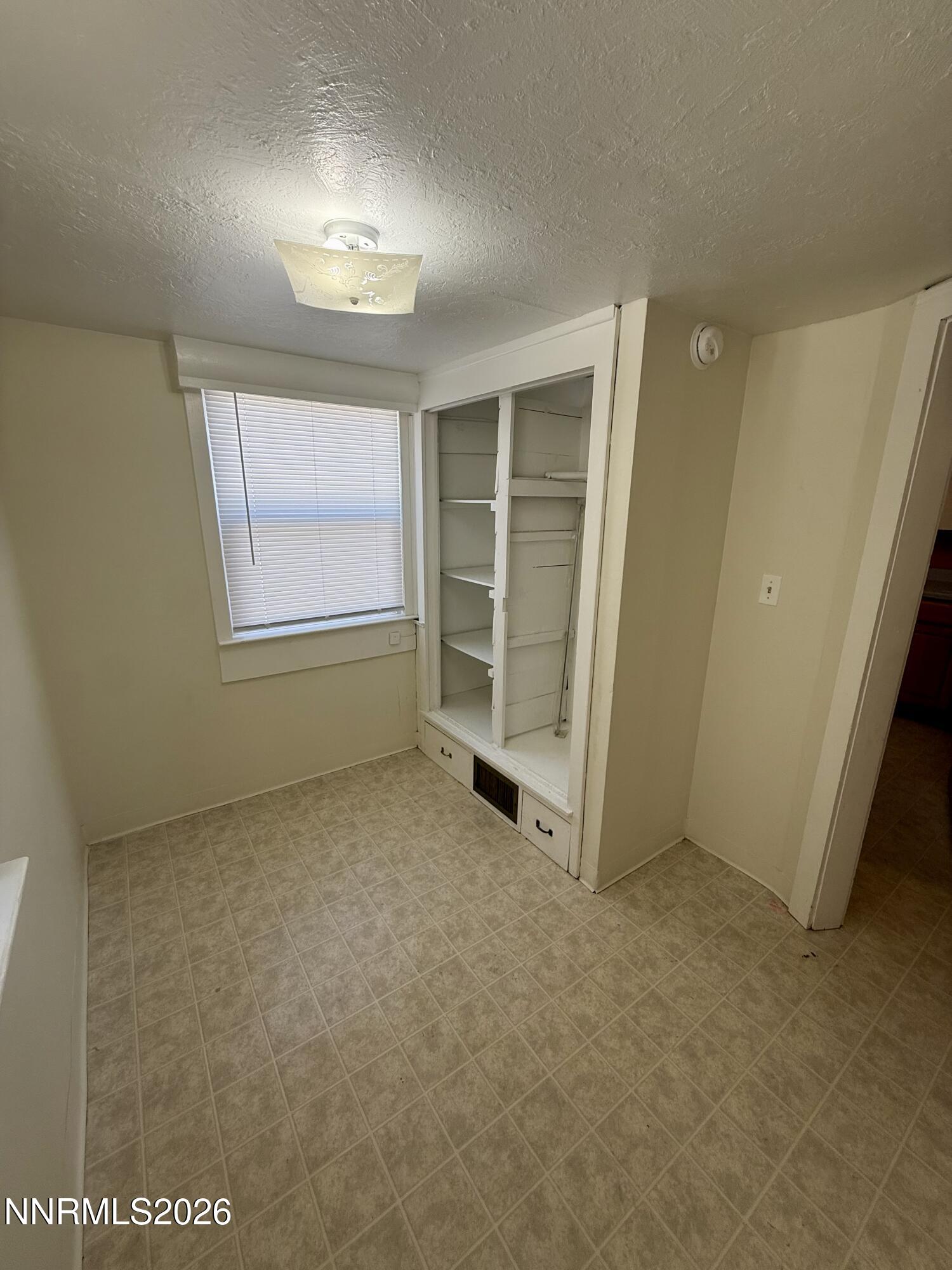 745 West Center Street Fallon, NV 89406 - Photo 9 of 31 an empty room with windows and closet