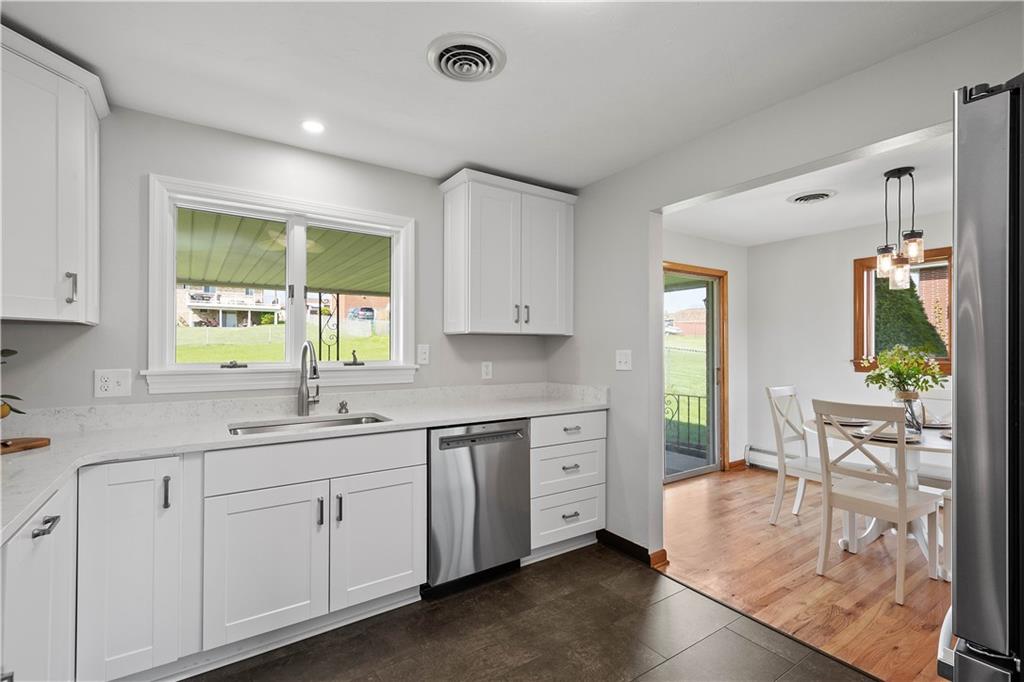 916 McGovern Road Houston, PA 15342 - Photo 18 of 44 Beautiful kitchen overlooking the back yard. The renovation added a dishwasher to the layout which makes dinner cleanup a breeze!