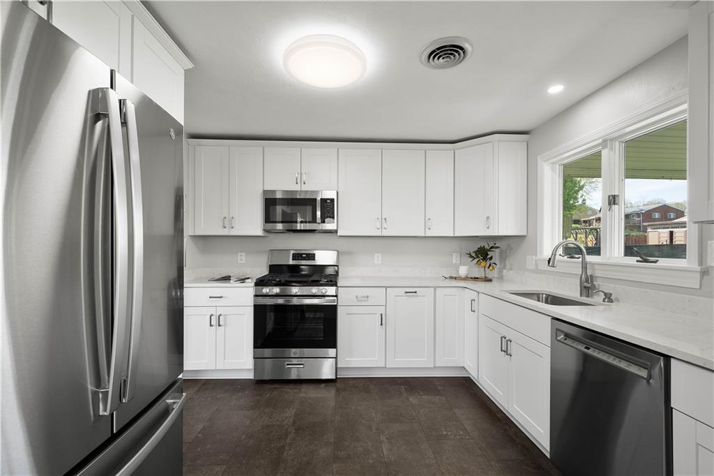 916 McGovern Road Houston, PA 15342 - Photo 21 of 44 The luxury vinyl tile flooring and the impressive white quartz countertops look amazing in your new kitchen!