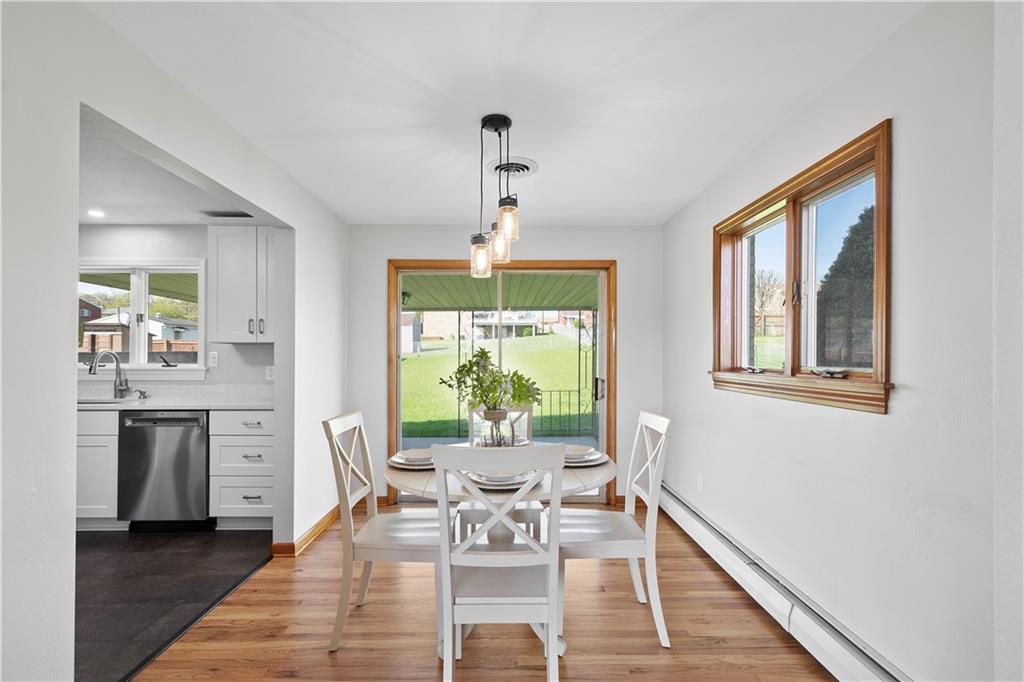 916 McGovern Road Houston, PA 15342 - Photo 23 of 44 The dining room boasts stunning refinished hardwood flooring, fresh paint, elegant lighting and direct access to the covered patio.