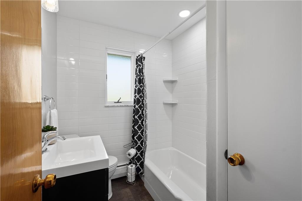 916 McGovern Road Houston, PA 15342 - Photo 30 of 44 The shared hall bathroom received a complete update with gorgeous subway tile wrapping the walls, a new vanity, light, and fixtures.