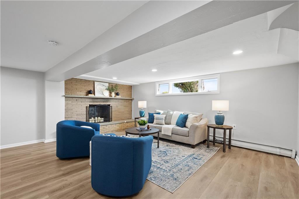 916 McGovern Road Houston, PA 15342 - Photo 34 of 44 The lower level game room is a complete transformation! New luxury vinyl plank flooring and a cozy wood burning fireplace will make this your favorite room in the house!