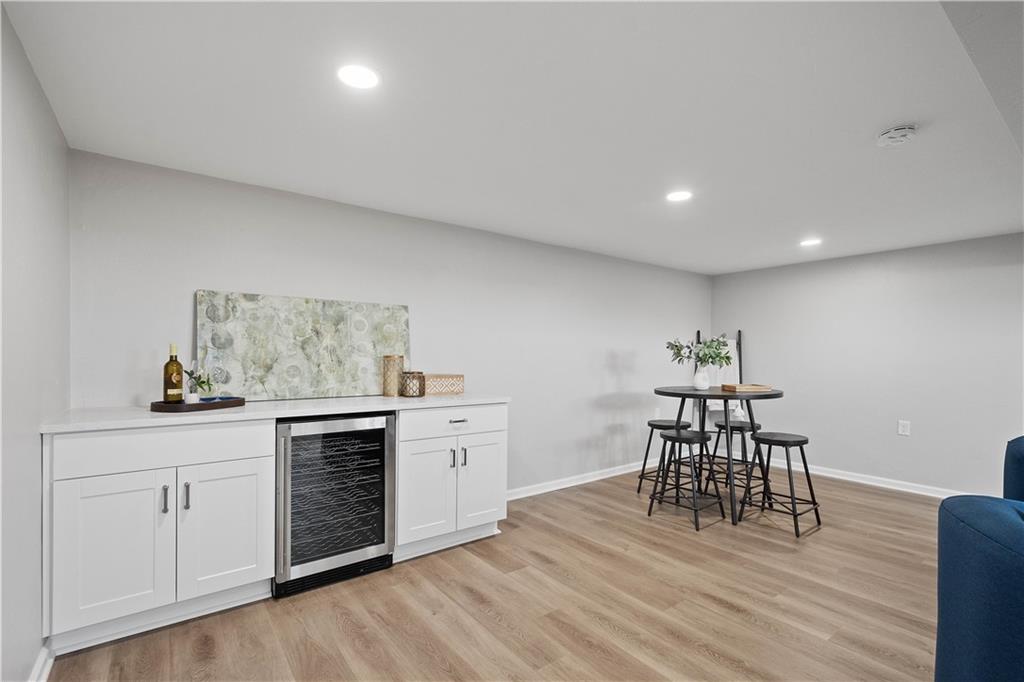 916 McGovern Road Houston, PA 15342 - Photo 37 of 44 White cabinetry, quartz countertops, a wine fridge and plenty of space to enjoy!