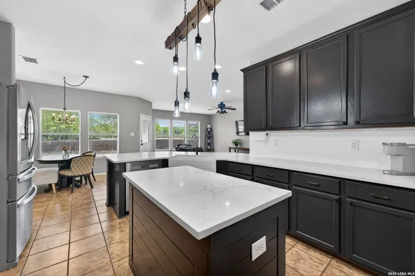 a kitchen with a sink a counter top space and appliances