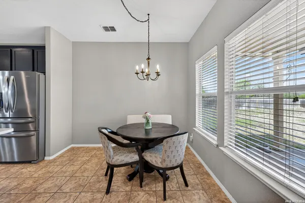 a dining room with furniture and window