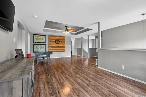 a living room with furniture and flat screen tv