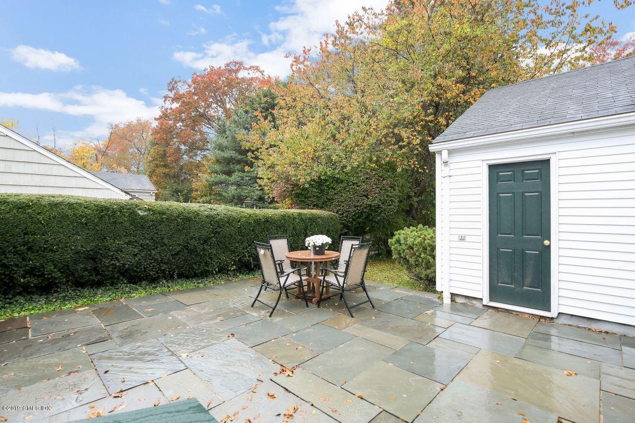 87 Lockwood Road Riverside, CT 06878 - Photo 8 of 29 a view of a patio with table and chairs and potted plants