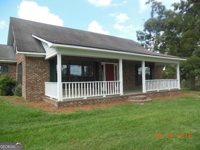 978 Blaxton Road Vidalia, GA 30474 - Photo 1 of 1 a porch with a yard