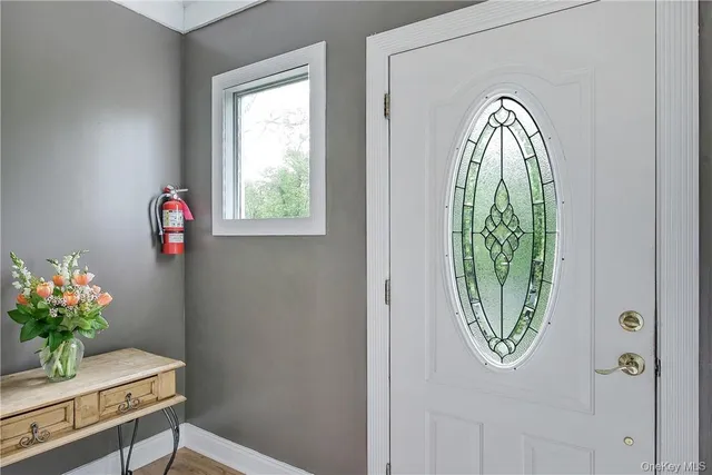 a view of entryway with wooden floor