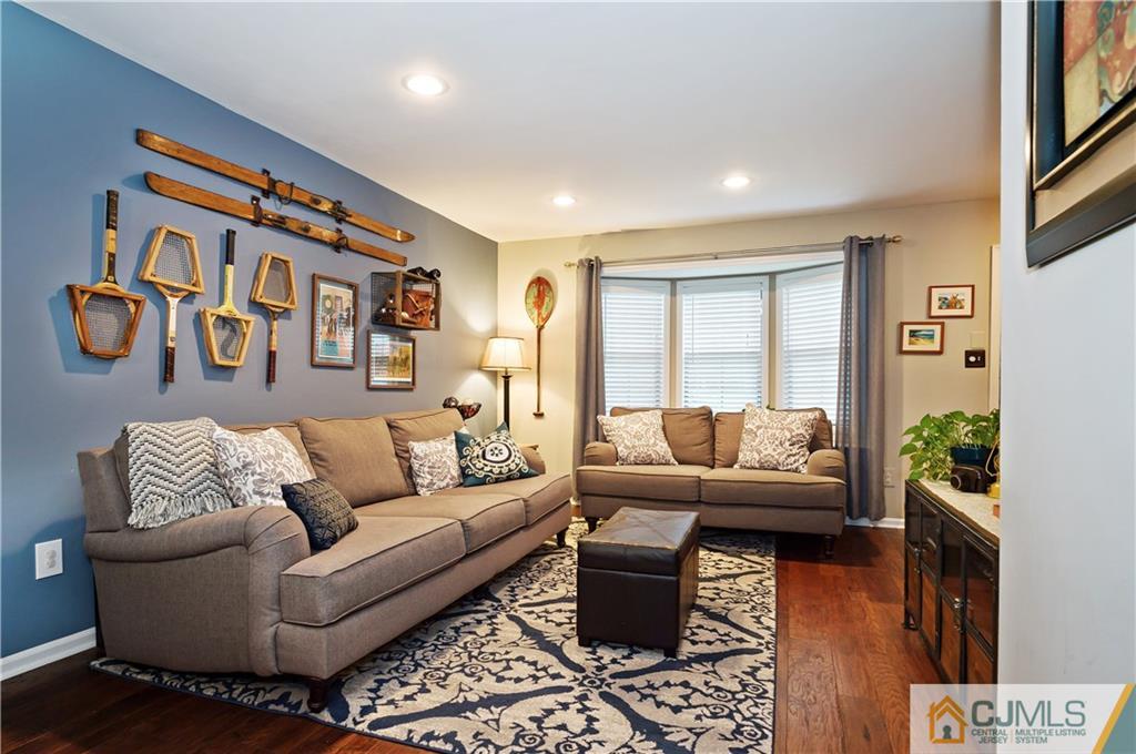 2406 Timber Oaks Road, Unit 2406 Edison, NJ 08820 - Photo 12 of 24 a living room with furniture and a large window