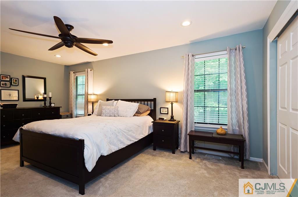 2406 Timber Oaks Road, Unit 2406 Edison, NJ 08820 - Photo 17 of 24 a bed room with a bed and a window