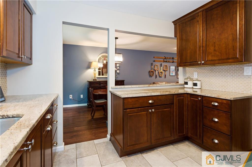 2406 Timber Oaks Road, Unit 2406 Edison, NJ 08820 - Photo 5 of 24 a kitchen with a sink and cabinets