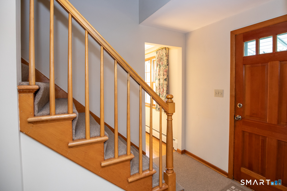 153 Fiesta Heights Meriden, CT 06451 - Photo 4 of 32 Foyer and stairs to second floor