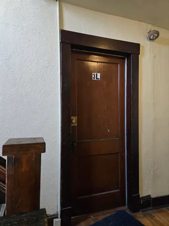 a kitchen with a refrigerator and a stove