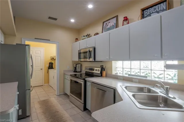 a kitchen with a stove and a microwave