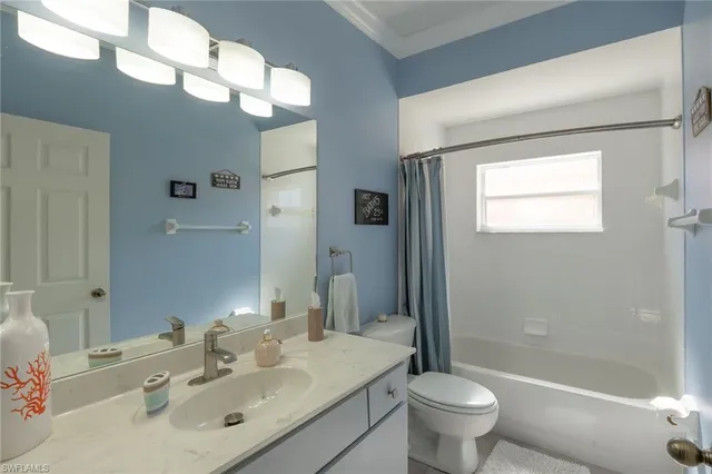 a bath room with a toilet and a bath tub