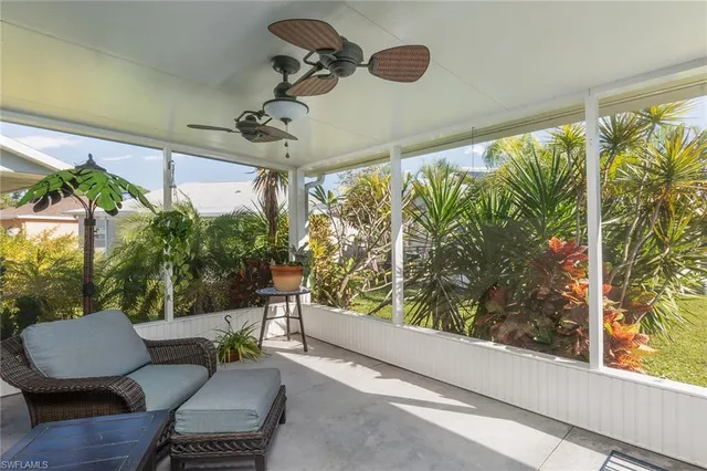 an aerial view of a house with a lake view
