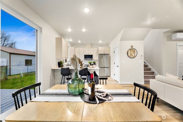 a view of dining hall with furniture and windows