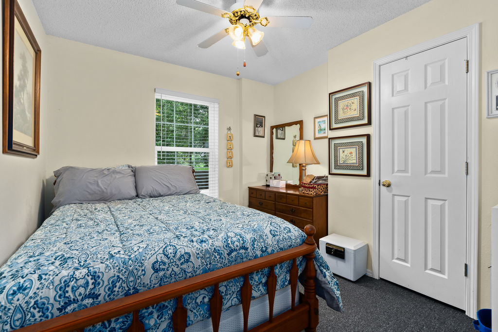 365 Calihan Road Booneville, AR 72927 - Photo 55 of 59 Cream-painted walls and dark carpet flooring