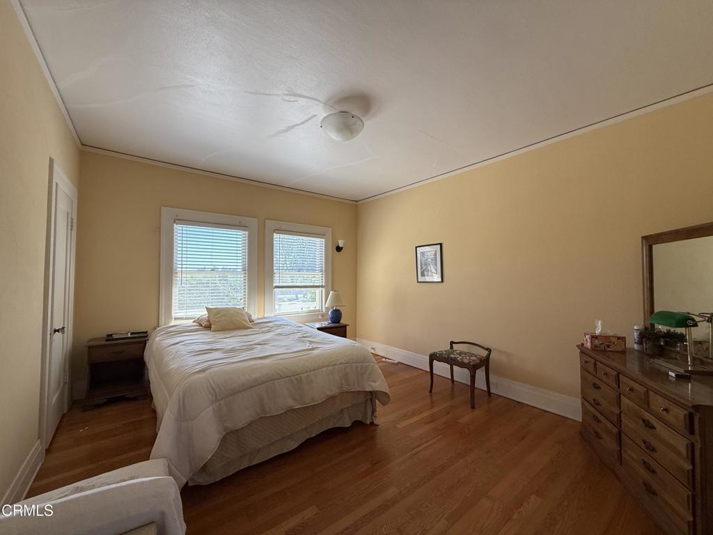 4645 Walnut Avenue Somis, CA 93066 - Photo 14 of 28 a bedroom with a bed and a table in it