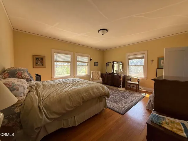 a view of a kitchen with a sink and a refrigerator