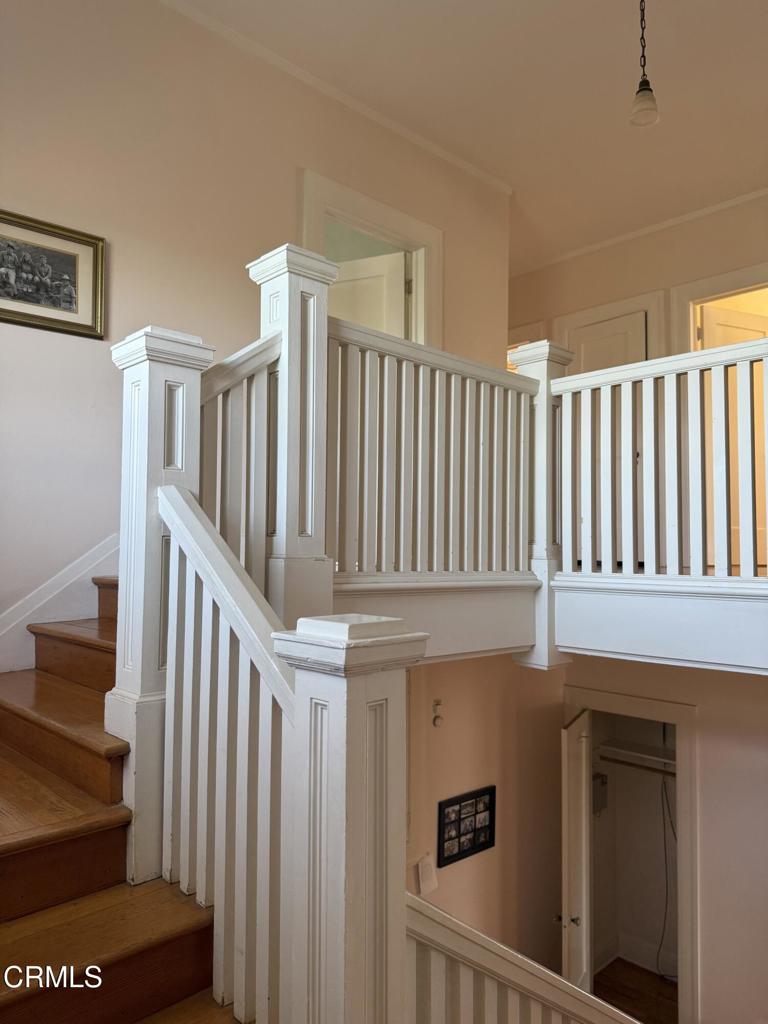 4645 Walnut Avenue Somis, CA 93066 - Photo 19 of 28 a view of staircase with lots of frames on wall and a window