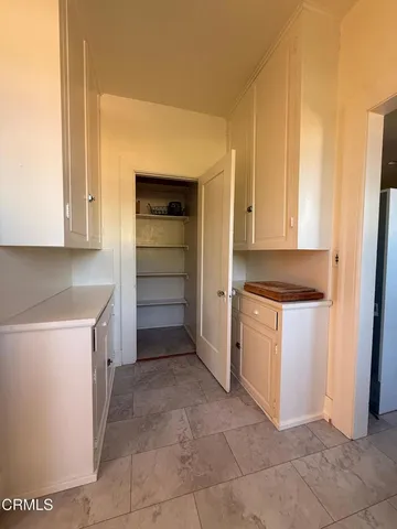 a bathroom with a tub shower vanity and a sink